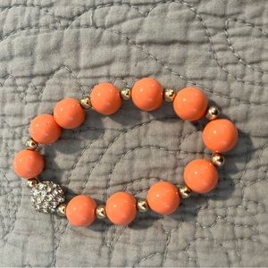 Peach and gold round bead bracelet